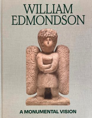 Cover of the book 'William Edmondson: A Monumental Vision', showing a sculpture of an angel carved in stone.