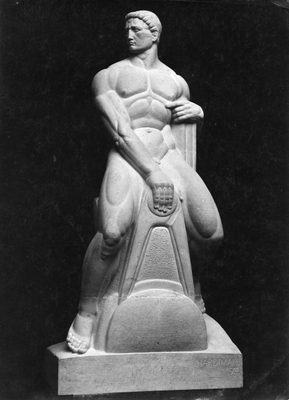 Sculpture by Alfred Hardiman of a muscular nude man, casually but powerfully sat astride a large set of calipers.