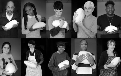 Ten individual black-and-white portraits of people holding smooth round white sculptures in their hands, arranged in a 5x2 grid.
