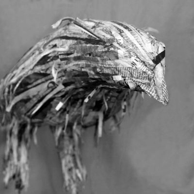 A sculpture made from shredded newspaper, which looks somewhat like a crow.