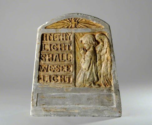 Relief sculpture of a praying cherub, with the inscription 'In thy light shall we see light' next to them.