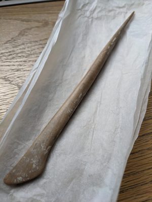 A wooden modelling tool.