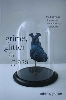 Cover of the book grime, glitter & glass by Nikki A. Green, with a photo of a sculpture of a black heart inside a domed glass container.