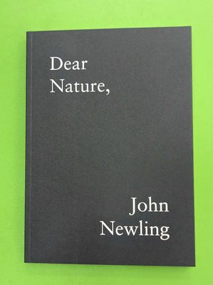 Front cover of a book, a dark grey rectangle bordered by lime green. The title reads 