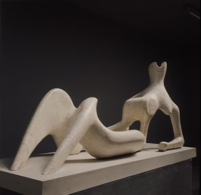 A studio photo of a plaster sculpture depicting an abstracted Reclining Figure
