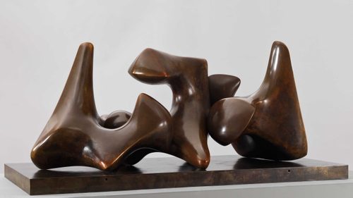 Abstract bronze sculpture by Henry Moore, composed of three pieces that give the impression of interlocking vertebrae.
