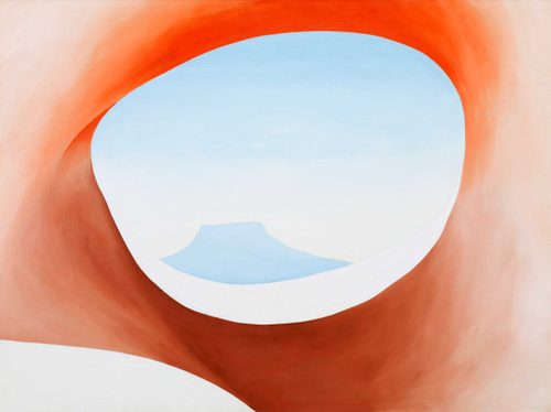 Painting by Georgia O'Keefe. A distant mountain is framed through the eye socket of an animal's skull, cropped in close to make it hard to tell what it is at first.