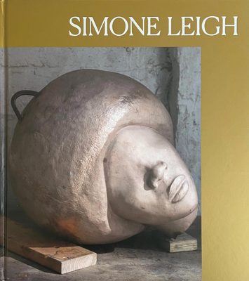 Cover of the book 'Simone Leigh', shwing a carving of a head with afro hairstyle and no eyes.